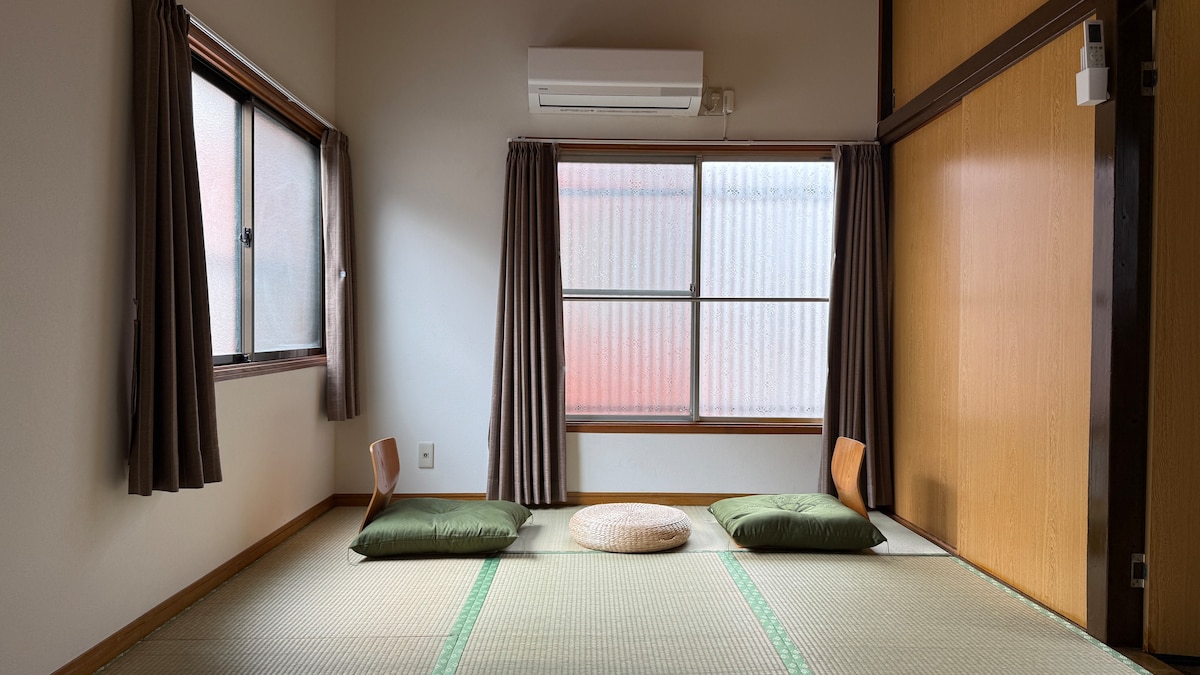 Wooden lattice window and noren details at Hanagawaya Asakusa